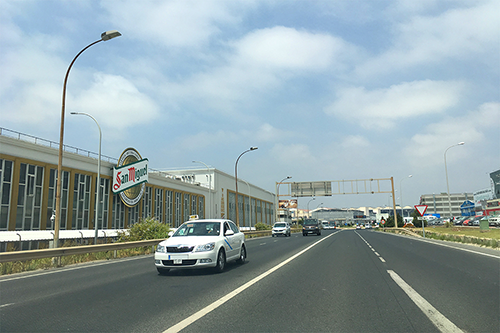 The photo captures the surroundings near Malaga Airport, specifically taken on the road in close proximity to the airport.